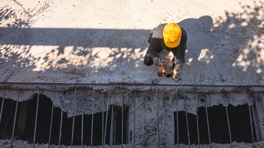 Construction professional reviewing plans on site